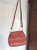 Jimmy Choo Rust-colored grained shoulder bag/pouch