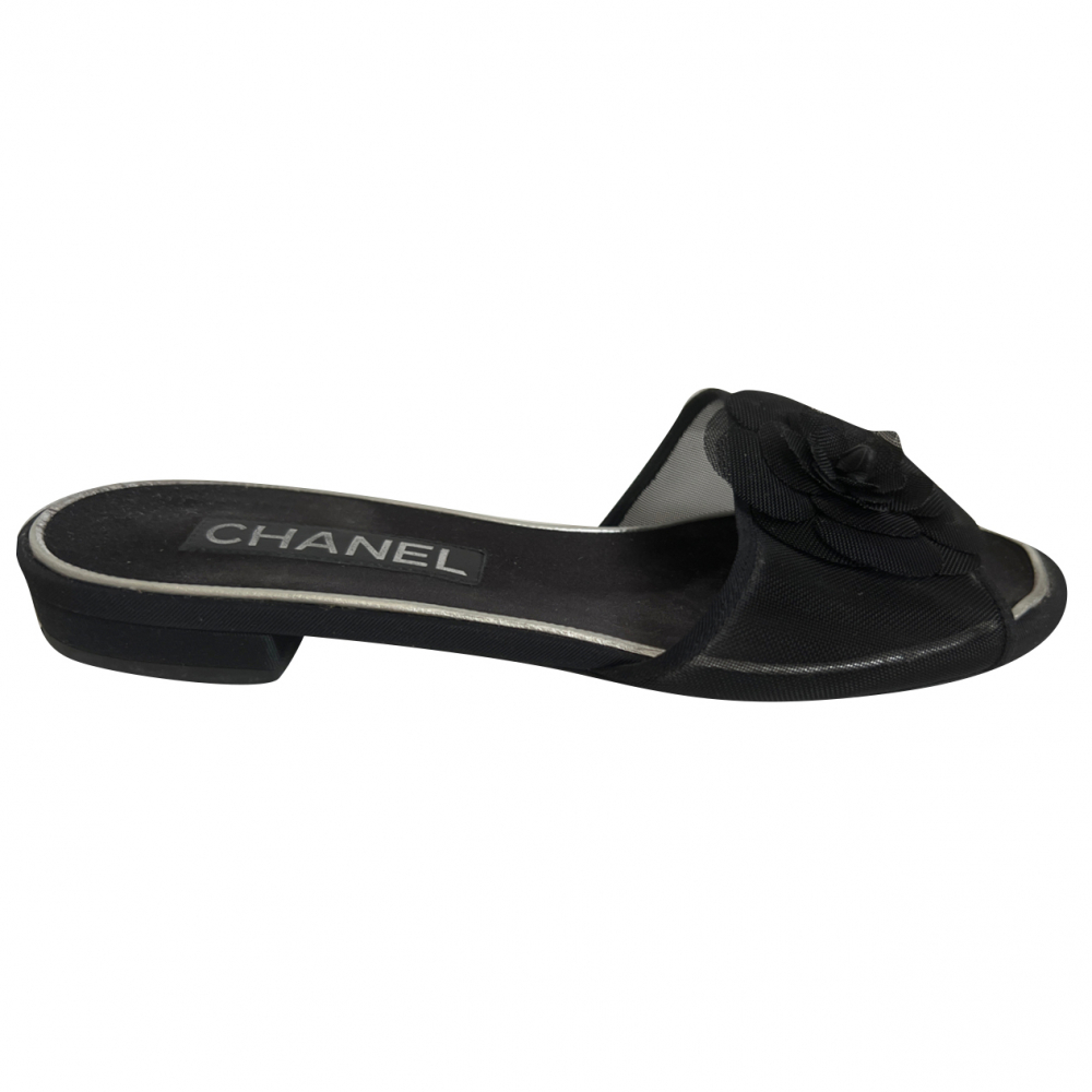 Chanel discount camellia mules